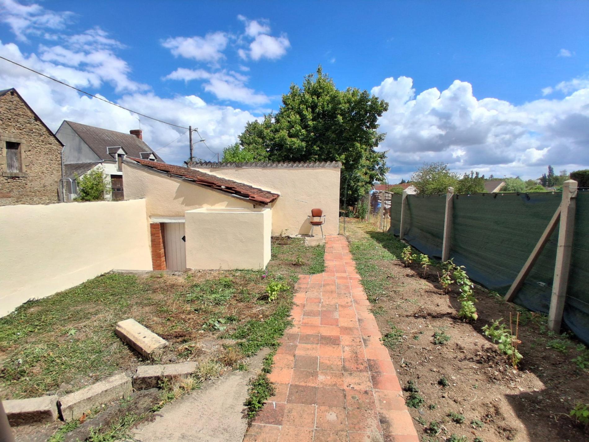 Maison de ville avec jardin et garage !