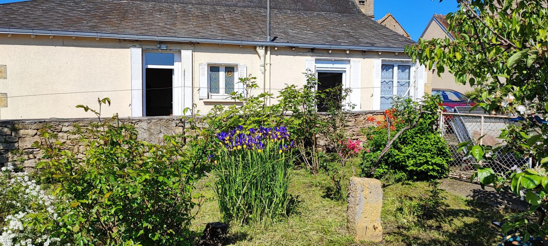 Maison de plain pied avec jardin et garage !